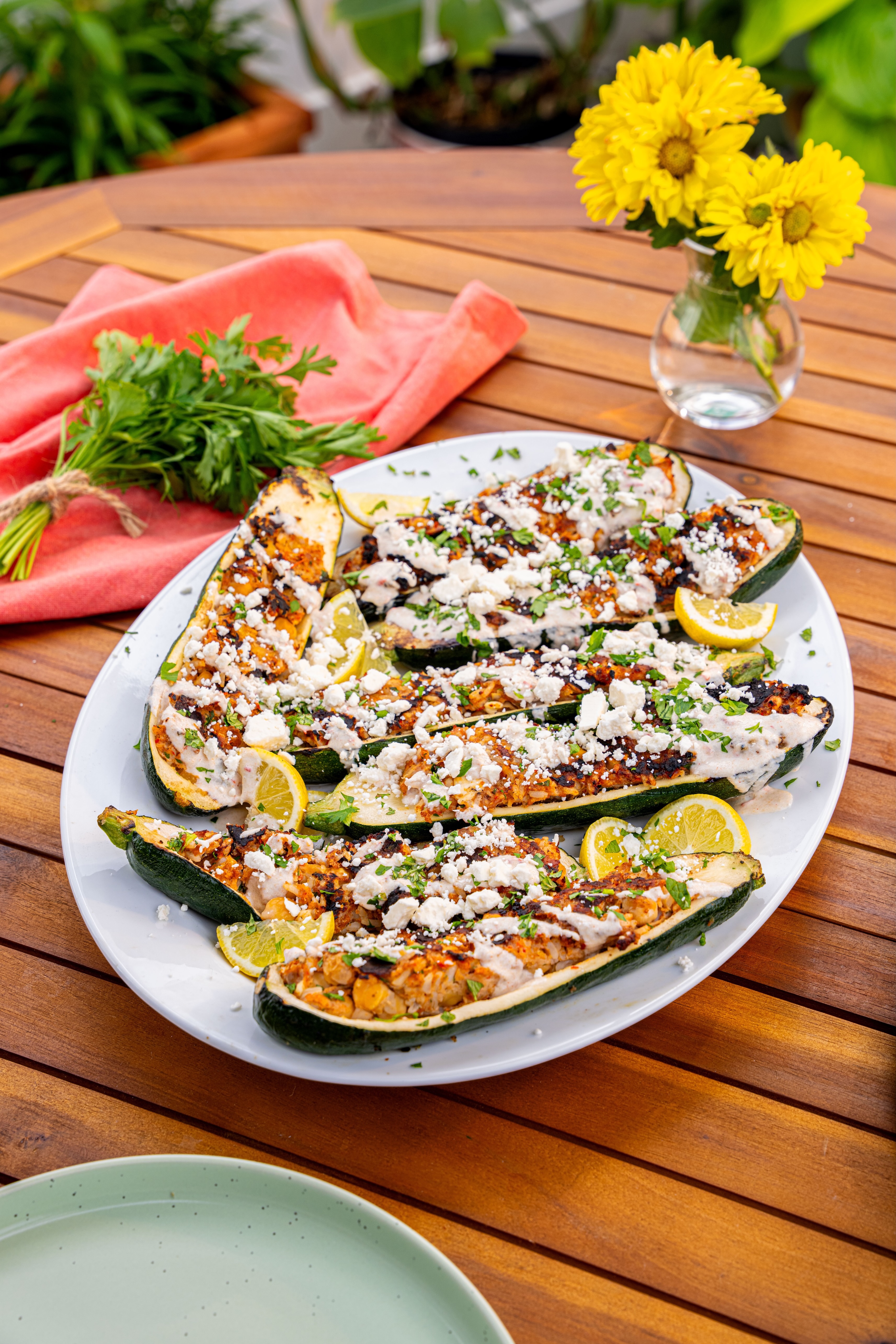 A platter of grilled ground turkey-stuffed zucchini boats.