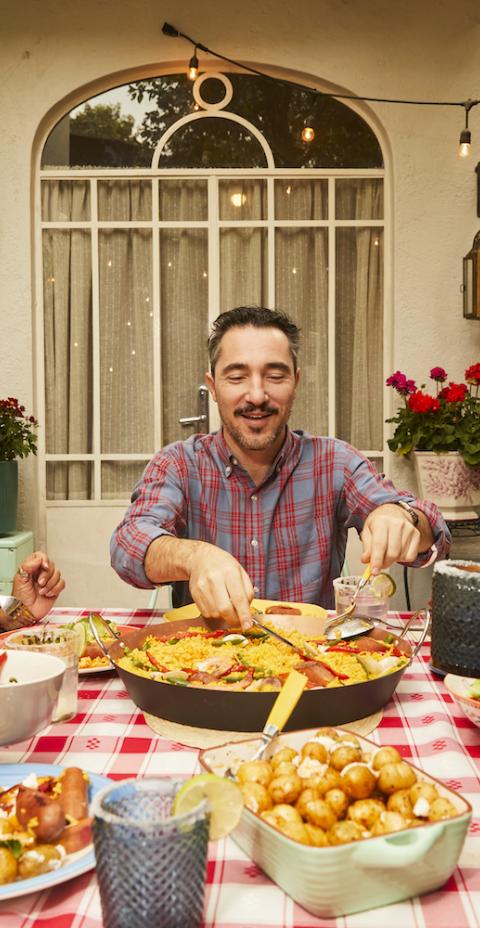 Family gathering around dinner table