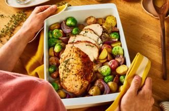 A Butterball roast turkey breast with thyme lemon sauce, brussels sprouts, and red onion. 