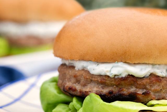 Butterball turkey burger with creamy sauce and lettuce, served on a bun for a fresh summer meal.