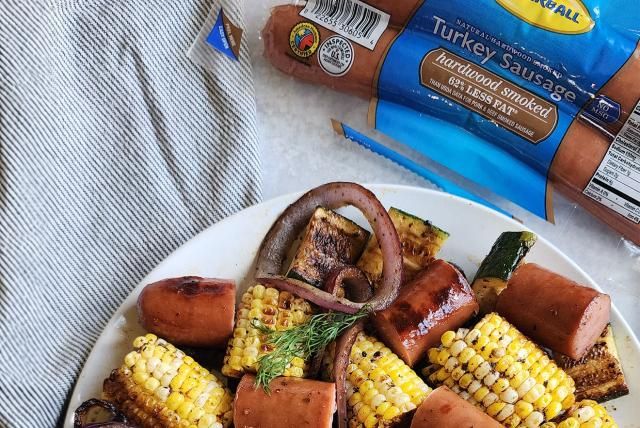 Image of Grilled Sausage and Vegetables with Garlic Butter.